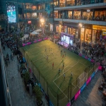 **Young Indian boys and girls playing football on a small 5v5 pitch inside a modern shopping mall, vibrant Premier League branding on boards and banners, a live rap performance on a small stage beside the pitch, energetic crowd of fans filling the upper levels and stands, colorful mall lighting, dynamic motion blur, excited expressions, streetwear outfits, celebratory atmosphere, high-energy urban sports festival vibe, ultra-realistic, cinematic lighting, wide-angle shot --ar 16:9** - Image #3 <@1263206055928791131>