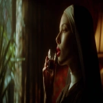 **a nun drinks chocolate tequila from a shot glas, while standing in a dark and old bedroom of 1980s, the nun is very attractive, has red lips and looks towards the window, shot from the side, photography, --ar 16:9** - Image #4 <@1073526258069151775>