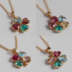 **Realistic image of a polished yellow gold necklace with a delicate chain and a four-leaf clover pendant. The first and second petals are heart-cut rubies, the third petal is a heart-cut aquamarine, and the fourth petal is a heart-cut emerald. The image has high resolution and lighting that enhances its beauty.** - Variations (Strong) by <@1369435329731362987> (fast)