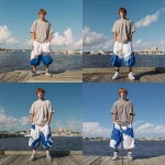 **A young handsome tan skinned white man with light brown hair cut short in a wavy shaggy hairstyle dressed in a Y2K Cholo gangster style, wearing a Shaka grey t shirt and extremely baggy, extra-long, 3XL plain white and blue Jordan basketball shorts. He is wearing Nike shoes standing on a dock in Jacksonville Florida. His shorts go down to his feet touching the ground and his shoes --v 7.0** - Remix (Strong) by <@1061360796438900746> (fast)