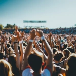 **wide angle sports crowd standing and cheering, shot from behind , day time, summer vibrant feeling, realism, Camera: DSLR - Canon EOS 5D Mark IV. Lens: Canon EF 24-70mm f/2.8L II USM** - Image #2 <@1252403463975866382>