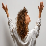 **a woman with one hand reaching up for something from back view, with mad expression, with clean white background --ar 16:9 --v 7.0 --s 250** - Image #1 <@1099146359967338649>