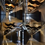 **a bright data center server room, with hanging wave sound baffles, lighted black servers, and felt sound panels on the ceiling and walls --v 6.0 --ar 3:2** - Variations (Strong) by <@1048957466093813870> (fast)
