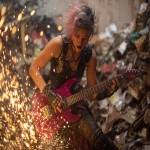 **heavy metal femmerock reptilian 80s hair bandsaw sawing through electric guitars, sparks and debris flying everywhereas the band plays down with the thickness --p djcuvnt ht8lvr3 --ar 4:3** - Image #3 <@948741381743083580>
