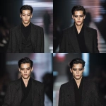 **full-body runway shot of a fashionable 30-year-old Taiwanese man, long-shaped face, fair pale skin, thick eyebrows, large expressive double-lidded eyes, naturally full lips, cheeks softly contoured (not sunken); styled with bold high-fashion smokey eye makeup in deep charcoal and cocoa tones, paired with glossy lip color; contemporary hairstyle with clean lines; walking confidently on a glossy fashion runway under cinematic spotlights, blurred audience and LED backdrop, minimal avant-garde outfit that complements the makeup without distraction; high-contrast editorial lighting, sharp focus on face and makeup while preserving runway motion, premium fashion magazine aesthetic, no text, no watermark --ar 1:1** - Variations (Strong) by <@1090872516857299025> (fast)