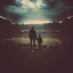 **father and son holding hands in a football stadium, they are far from the photo, fans in the background** - Image #3 <@450124934837043201>