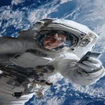 **The photo should be hyperrealistic but with distorted proportions. The framing should distort the proportions, prioritizing the head and shrinking the legs and feet. A 40-year-old female astronaut is on a spacewalk, having fun, smiling, and wearing a transparent helmet. In the background is planet Earth. She is holding a smartphone in her right hand and looking at the screen. Focus on the arm and the phone in the foreground. Use of a wide-angle lens. Natural light, surreal photo, crazy proportions. --ar 9:16** - Image #3 <@1310560084346146826>