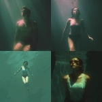 **Underwater swimmer lit from above, diffused sunlight in muted peach, moonstone, and celadon, serene body language, quiet reflections on skin. --profile fbik8zy --v 7.0** - <@997706764311089183> (fast)