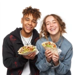 **two students happily eating kebab wraps, photo, white background** - Image #3 <@1019171884983648307>