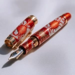 **Festive Holiday Crustacean fountain pen.** - Image #2 <@639231094968942592>