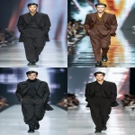 **full-body runway shot of a fashionable 30-year-old Taiwanese man, long-shaped face, fair pale skin, thick eyebrows, large expressive double-lidded eyes, naturally full lips, cheeks softly contoured (not sunken); styled with bold high-fashion smokey eye makeup in deep charcoal and cocoa tones, paired with glossy lip color; contemporary hairstyle with clean lines; walking confidently on a glossy fashion runway under cinematic spotlights, blurred audience and LED backdrop, minimal avant-garde outfit that complements the makeup without distraction; high-contrast editorial lighting, sharp focus on face and makeup while preserving runway motion, premium fashion magazine aesthetic, no text, no watermark --ar 9:16** - <@1090872516857299025> (fast)