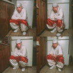 **A young handsome tan skinned teenage white man wearing a white Durag dressed in a Y2K Cholo gangster style, wearing a long sleeve white t shirt and extremely baggy, extra-long, 3XL plain long red and white Jordan basketball shorts. His shorts are very long and go down to his ankles and feet. He is wearing a white Durag around his head. He is wearing Nike Cortez shoes standing in his house by a Christmas tree --v 7.0** - Variations (Subtle) by <@1061360796438900746> (fast)