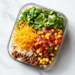 **Realistic taco rice bowl with ground beef, rice, corn, cheese, salsa, and greens layered in a rectangle glass meal prep container, white marble kitchen countertop, bright natural lighting, clean and sharp food styling** - Image #3 <@1100234890030620782>