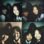 **This is a realistic, but blurry, out-of-focus, and grainy, color photograph. It was taken in a classroom (likely a Japanese junior high school) and shows two female students. The student on the right has wavy, shoulder-length black hair and a broad smile. The student on the left is only partially visible, her black hair short, and only part of her face is visible within the frame. A blurry figure is faintly visible in the background, behind and between the girls. The figure's face is largely blurred and indistinct, and its expression is dark and shadowed, making it difficult to discern. This suggests a sinister or ghostly presence. The background is somewhat dark and out-of-focus, suggesting a dimly lit classroom. A light from the front clearly illuminates the smiling cheeks. The overall atmosphere in the foreground is casual and friendly, but the dark, face-filled figure in the background subtly creates an unsettling and mysterious atmosphere. This is a realistic, blurry, out-of-focus, and very grainy color photograph.** - <@1036285603907633172> (relaxed)