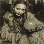 **1920 woman sitting in a robe holding a prophetic iris ball of crystal, exaggerated dark makup in the eyes, staring the camera, very old ferrotype crackled borders photography, in the style of ritualistic masks, vaudeville presentation, contemporary ferrotype photography, wiccan, indian scenes, 1920s --ar 87:112 --stylize 750 --v 7.0** - Image #4 <@939791412201934889>