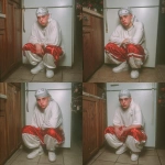 **A young handsome tan skinned teenage white man wearing a white Durag dressed in a Y2K Cholo gangster style, wearing a long sleeve white t shirt and extremely baggy, extra-long, 3XL plain long red and white Jordan basketball shorts. His shorts are very long and go down to his ankles and feet. He is wearing a white Durag around his head. He is wearing Nike Cortez shoes standing in his house by a Christmas tree --v 7.0** - Variations (Subtle) by <@1061360796438900746> (fast)