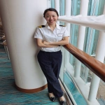 **iPhone photo of a woman in a cruise ship crew uniform, 25 years old, beautiful, full-length --ar 3:4 --s 50 --raw --v 7.0** - Image #1 <@1264344222698307735>