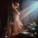 **1970s film grainy photograph. A twinkling waterfall. Big statues of freestanding walls, covered with black tiny rainbow colored holographic rhinestones glinting in the sun. Around the statue is a fashion model, some curvy plus-size, some of different ethnicities. She wears an opulent gothic futuristic pink and blue, satin lace and fish-net outfit, adorned with roses. Eerie sci-fi aesthetic. Bright colorful light. sparkly airy misty twinkles fall from the sky. Orange, peach, pink, blue, lime green, purple --v 7.0 --ar 2:3** - Image #4 <@840730232632639528>