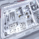 **exploded view of an interstellar welding experience kit laid out in a cleanroom-grade modular case, containing TIG welding torch with articulated gimbal mount, tungsten electrodes in vacuum-sealed pods, brushed stainless steel test panels, compact argon gas recycler with carbon capture ring, digital weld control interface with haptic feedback knobs, auto-darkening visor with atmospheric readouts, pressure-regulated gloves and insulation sleeves, microgravity alignment clamps, magnetic grounding matrix, illuminated setup under sterile white lighting, Martian red dust visible on outer shell, environment reads as pressurized mobile fab station, cinematic ultra-detail, technical product photography style --ar 3:2 --q 2 --s 50 --p z4f83u2 --v 7.0 --raw** - Upscaled by <@997245562065789039> (relaxed)