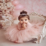 **baby girl styled with an elegant princess bun, smooth brown hair adorned with a tiny silver tiara, wearing a soft pink tulle dress, sitting in a decorative chair Shot with Canon EOS R8, 85mm lens, f/2.0, ISO 100, White Balance 5600K, Portrait Studio Setup --ar 2:3 --v 7.0** - Upscaled by <@888546328244801596> (fast)
-# Create, explore, and organize on [midjourney.com](<https://midjourney.com/imagine?from_discord=1>)