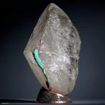 **on display. A random piece of crystal art in the style of Abstract Expressionism art period artists. This crystal has been cracked and broken. The large repair along the side of the quartz is of turquoise stone used to mend it. The base has patina copper and layered black rock. The base is adorned with carved magical sigils. High-end, high-quality cultural design. --c 85 --s 700 --w 450 --v 7.0** - Image #2 <@923747341717078036>