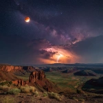 **Lunar Eclipse above a geomagnetic aurora lightning storm in the sierra desert, cliffs and mesas in the distance** - Image #1 <@1135636698060038216>