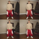 **A young handsome tan skinned white man with dirty blonde wavy short hair dressed in a Y2K Cholo gangster style, wearing a khaki long sleeve Dickies work shirt and extremely baggy, extra-long, 3XL plain long red and white Jordan basketball shorts. His shorts are very long and go down to his ankles and feet. He is wearing Nike Cortez shoes in his house by a Christmas tree --v 7.0** - Variations (Subtle) by <@1061360796438900746> (fast)
-# Create, explore, and organize on [midjourney.com](<https://midjourney.com/imagine?from_discord=1>)