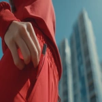 **close-up shot of woman in red running clothes putting red chapstick in a pocket. city background. realistic. day time. shot on sony venice --ar 16:9** - Image #3 <@1084475660803788890>