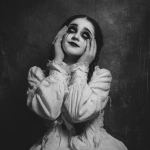**a black and white photo-realism of a young girl, in ragged white dress, and heavy, dark makeup. she i. she is looking upwards, with her fingers in her eye sockets and grinning. eerie, unsettling.** - Image #3 <@376196082390138880>