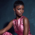 **dark skinned African American model in a mini shiny pink dress with pixie cut tapered hair style** - Image #2 <@1124019347283775508>