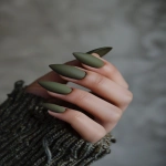 **olive green minimalist nails, soft matte or satin finish, almond shape, neutral tones, minimal styling, warm clean background --v 6.0 --ar 2:3** - Image #1 <@1321895242076520463>