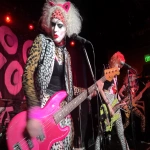 **scary kitty reptilian 80s hair band, performing cat scratch fever at the Roxy --ar 53:40 --p v1fj6df --q 2 --v 7.0** - Image #1 <@1059292469474373672>
