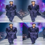 **full-body runway shot of a fashionable 30-year-old Taiwanese man, long-shaped face, fair pale skin, thick eyebrows, large expressive double-lidded eyes, naturally full lips, softly contoured cheeks not sunken; styled with bold smokey eye makeup and glossy lip color, paired with avant-garde fashion outfit, contemporary hairstyle; walking confidently on a glossy runway stage with cinematic spotlight, blurred audience in the background, dramatic high-fashion editorial photography style, sharp focus on makeup and hair, elegant and powerful vibe, no text, no watermark --ar 9:16** - Variations (Strong) by <@1090872516857299025> (fast)