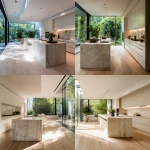 **Captured by a world-class luxury architectural photographer, Hasselblad 500CM, 80mm lens, f/4, ISO 100, 1/60s shutter. Camera positioned at slightly above countertop height for a natural yet immersive perspective. Wide horizontal composition showing the entire open-plan kitchen seamlessly integrated into the living area. Natural light from full-height glass doors spilling across pale timber flooring, lifted shadows, bloomy highlights. Foreground: oversized island in washed white oak with a honed light stone waterfall edge. Midground: minimalist cabinetry in matte warm white with concealed handles. Background: blurred rainforest greenery visible through glazing, slightly desaturated to keep focus inside. Depth of field shallow enough to soften background foliage while keeping kitchen surfaces razor shar** - <@837237355722571776> (fast)