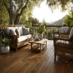 **a magazine quality photo realistic image of a backyard deck. The deck is made out of brown treated lumber that looks new. it is styled with restoration-hardware furniture and has a modern look. It is golden hour in the summer. The photo is for a wood protector ad in a magazine. --ar 5:4** - Image #2 <@1149448379978489937>