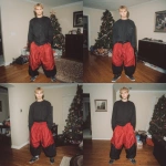 **A young handsome tan skinned white man with dirty blonde wavy short hair dressed in a Y2K Cholo gangster style, wearing a black long sleeve Dickies work shirt and extremely baggy, extra-long, 3XL plain long red and black Nike basketball shorts. His shorts are very long and go down to his ankles and feet. He is wearing Nike Cortez shoes in his house by a Christmas tree** - Variations (Strong) by <@1061360796438900746> (fast)