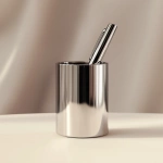 **Realistic close-up of a luxury pen set inside a minimalist metallic pen holder, isolated on a clean light beige background, camera facing at table level, soft shadows and reflections on the metal, high gloss texture, fully focused shot, --ar 4:5 --v 6.1 --quality 2 --raw** - Image #1 <@1145244586088861708>