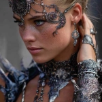 **close-up of a high fashion model wearing intricate iridium necklace, earrings, bracelets, and hair decorations, --v 7.0** - Image #2 <@559099678189289495>