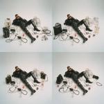**advertising shot of balenciaga, white background. a man wearing black and high boots is lying on the ground with his phone in hand, making a call while holding bags from balenciaga, surrounded by cables, coffee cups, and glasses. the scene was designed in the style of john galliano for vogue magazine. it's a masterpiece! --ar 1:1** - Zoom Out by <@1140324697154797598> (fast)