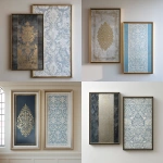 **Two large wall art frames with a grey and white metallic texture. One framed piece has a very simple hand-painted gold design on top of a dark grey canvas, while the second piece has an elaborate white pattern on a light blue background. The two pieces have different sizes and appear to be hanging side by side in front of a plain cream-colored wall. The intricate details include glass French windows and fine silver accents on each frame. --ar 128:119** - <@1313000520759377972> (fast)
