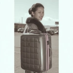 **<https://s.mj.run/2J3G2E0ob70> Geomagnetic storm. A 18-year-old female model, dressed fashionably, with a smile on her face, behaving gracefully, her hair neatly combed, carrying a suitcase in her hand, is outside the airport.** - Image #1 <@1348821992492630036>