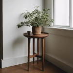 **A minimal cottagecore interior scene featuring a simple, empty plant stand or pedestal, with NOTHING on top, centered in the frame. The stand is an simple, understated, and antique in shape, serving as a placeholder only. Walnut wood and natural materials, soft curves, calm cottagecore aesthetic. Bright diffused daylight with an overcast feel, very soft or nearly invisible shadows, even lighting, low contrast. Clean, uncluttered background with l --v 5.0** - Image #3 <@1090435486935433258>