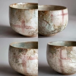 **Photorealistic close-up of an elegant handmade ceramic cup, inspired by nature and calmness, organic shape, soft textures, subtle imperfections, gentle pastel color palette (muted beige, soft sage, pale blush), matte-to-silk glazed surface. A soft, realistic reflection of the Danish flag (red and white cross) visible in the glaze, subtle and abstract, not literal or dominant. Scandinavian aesthetic, natural diffused daylight, minimalistic composition, shallow depth of field, ultra-high detail, realistic shadows, professional studio photography 16:9 raw --v 7.0** - Variations (Strong) by <@1062788114764013599> (fast)