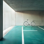 **concrete parkade with teal and large white bicycle icon to be modern and minimalistic --v 6.1 --s 50** - Image #1 <@1142491704994312252>