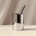 **Realistic close-up of a luxury pen set inside a minimalist metallic pen holder, isolated on a clean light beige background, camera facing at table level, soft shadows and reflections on the metal, high gloss texture, fully focused shot, --ar 4:5 --v 6.1 --quality 2 --raw** - Upscaled (Creative) by <@1145244586088861708> (relaxed)