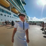 **iPhone photo of a woman in a cruise ship crew uniform, 25 years old, beautiful, full-length --ar 3:4 --s 50 --raw --v 7.0** - Image #4 <@1264344222698307735>