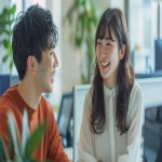 **Beautiful Japanese woman and handsome Japanese man smiling and talking together in a bright modern office, teamwork and friendly atmosphere, natural light, clean desk environment, cinematic lighting, professional recruitment photography, cheerful workplace vibe --ar 16:9 --v 6.0 --raw** - Image #2 <@1074578484602601522>