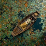 **40 year old Southeast Asian woman laying on a wooden boat floating on a lily filled river** - Image #2 <@1426411988254199929>