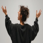 **a woman with one hand reaching up for something from back view, with mad expression, with clean white background --ar 16:9 --v 7.0 --s 250** - Image #4 <@1099146359967338649>