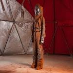**multipurpose Martian welding suit designed for pressurized fabrication, aramid-based outer shell resistant to arc flash and molten metal spatter, integrated flexible joints with high-mobility weld positioning support, layered thermal shielding, retractable welding visor, modular forearm torch mount and gas line routing, reflective dust-repellent surface coating, suit showing visible scorch marks from repeated use, staged in pressurized habitat dome with ambient red dust outside --ar 3:2 --q 2 --s 50 --p z4f83u2 --v 7.0 --raw** - Image #3 <@997245562065789039>